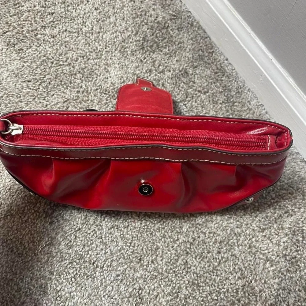 Red leather clutch handbag with silver hardware